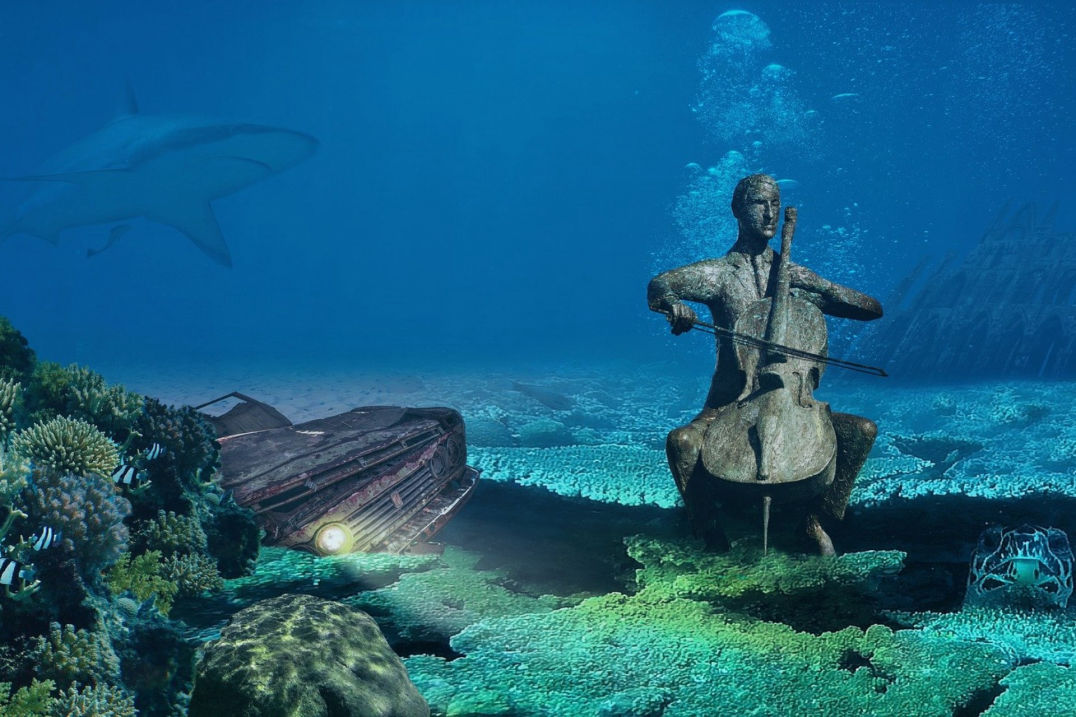 Skulptur eines Cellospielers unter Wasser: Kein Projekt erscheint unmöglich.